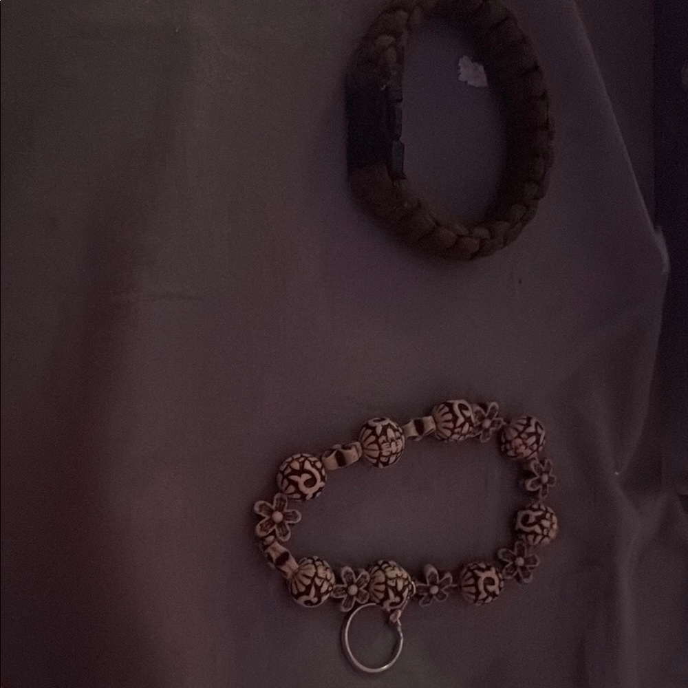 Bracelet with Floral Design one on bottom is a keychain top is bracelet